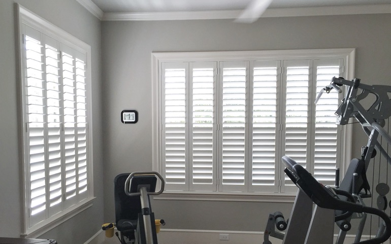 Detroit home gym with shuttered windows.